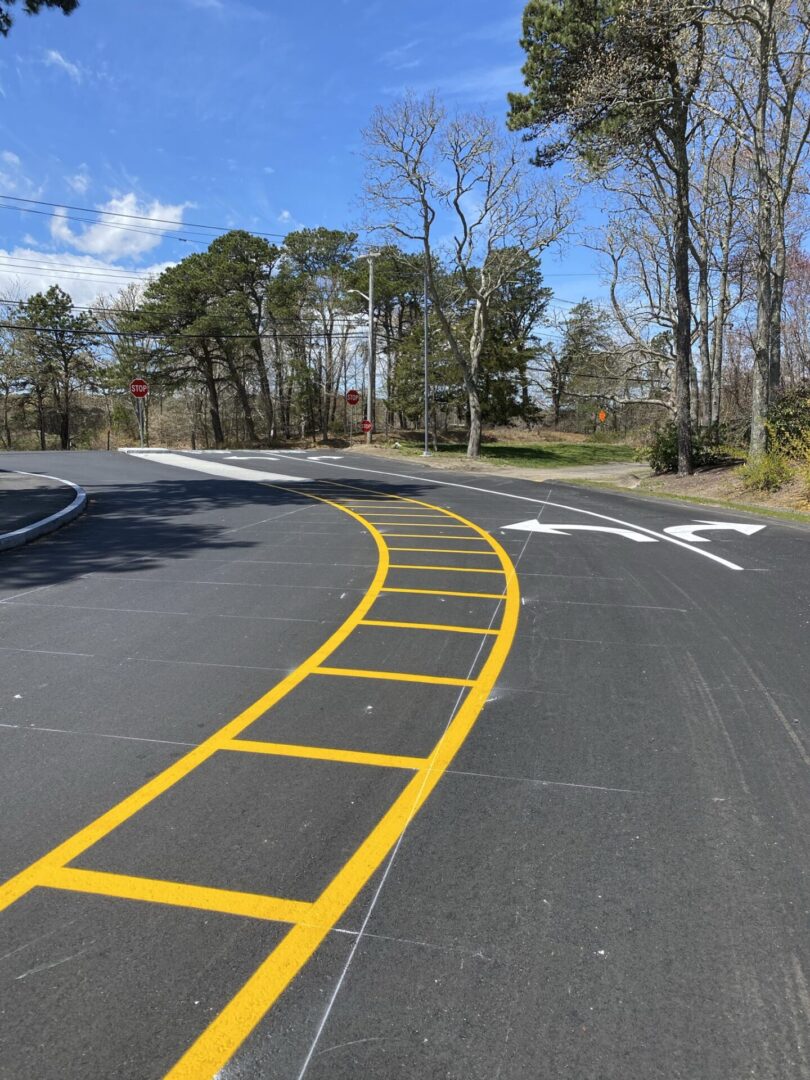 Plain road with yellow color ladder painted on it